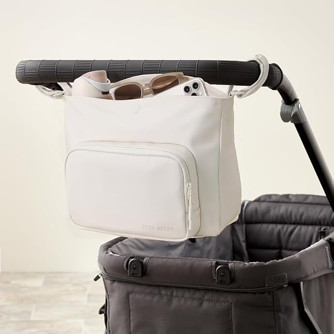 Itzy Ritzy Belong Cargo Caddy for Strollers & Wagons – Convertible Stroller Organizer and Crossbody Bag With Adjustable & Removable Strap, Bottle Holders, Smart Storage Pockets & Secure Straps (Cream)