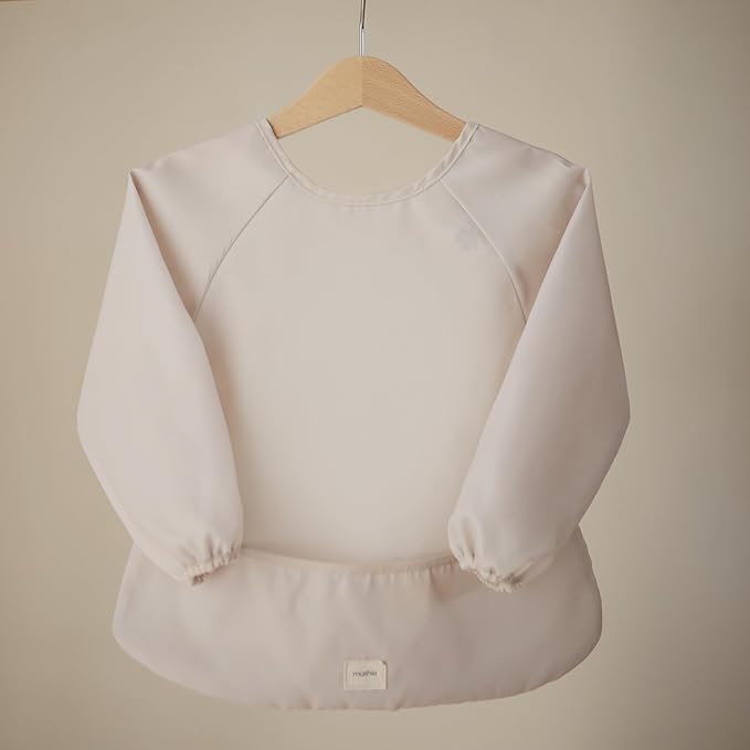 mushie Long Sleeve Baby Bib | Water Resistant Adjustable Fit for Ages 6-24 Months