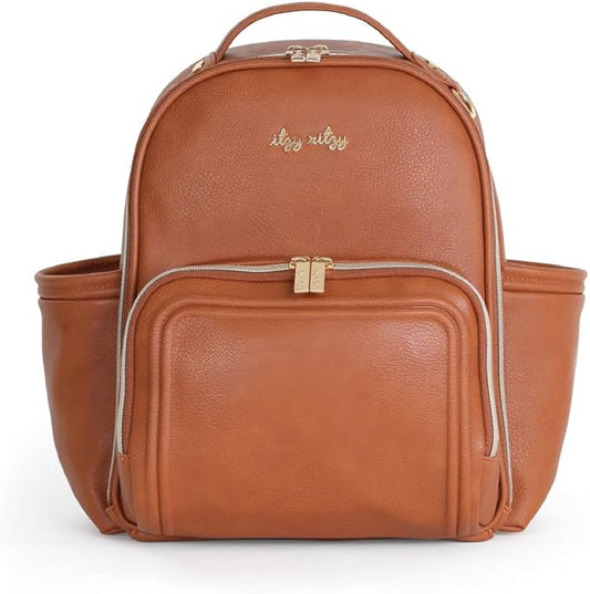 Itzy Ritzy Mini Diaper Bag Backpack – Chic, Compact Mini Plus Backpack with Changing Pad, 10 Pockets (6 Internal, 4 External), Grab-Top Handle & Rubber Feet (Cognac)