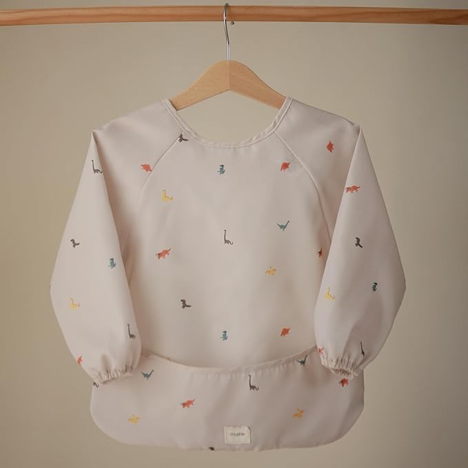 mushie Long Sleeve Baby Bib | Water Resistant Adjustable Fit for Ages 6-24 Months