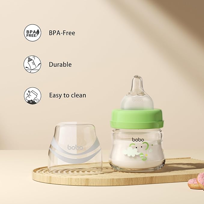 YOHKOH Glass Baby Bottles with Slow Flow Nipple, Newborn Anti-Colic Baby Bottles for 0+ Months, Wide Neck Feeding Bottle, Clear (Green, 2.7oz (Pack of 4))