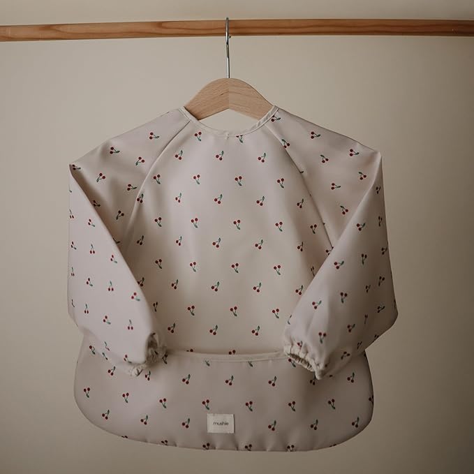 mushie Long Sleeve Baby Bib | Water Resistant Adjustable Fit for Ages 6-24 Months
