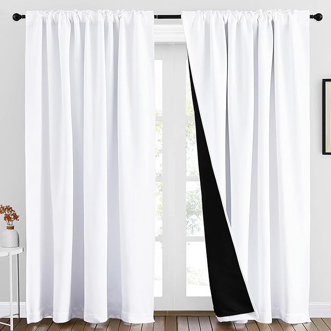 NICETOWN 100% Blackout Window Curtains, Cold and Full Light Blocking Drapes with Black Liner for Nursery, 84 Inches Thermal Insulated Draperies for Living Room (Pure White, 2 Pieces, 70 inches Wide)