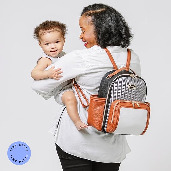 Itzy Ritzy Mini Diaper Bag Backpack – Chic, Compact Mini Plus Backpack with Changing Pad, 10 Pockets (6 Internal, 4 External), Grab-Top Handle & Rubber Feet (Coffee & Cream)