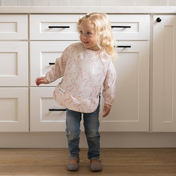 Tiny Twinkle Long Sleeve Bib for Babies & Toddlers | Waterproof Smock Bib for Eating | Machine Washable & Mess-Proof Feeding Essentials | Newborn Shower Gift (Bows, Small 6-24 Months)