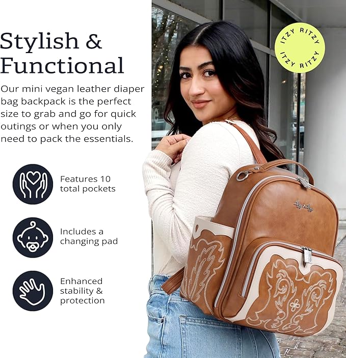 Itzy Ritzy Mini Diaper Bag Backpack – Chic, Compact Mini Plus Backpack with Changing Pad, 10 Pockets (6 Internal, 4 External), Grab-Top Handle & Rubber Feet (Saddle)
